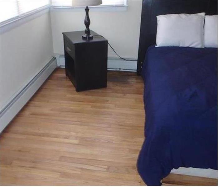 wood floor, black stains, moved nightstand and bed