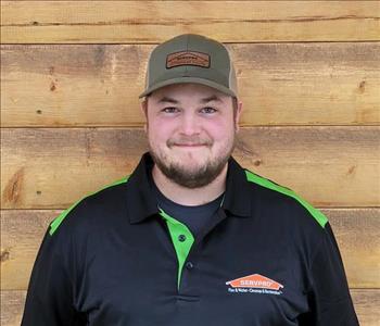 Picture of Logan Winn our Operations Manager, male employee in black SERVPRO polo