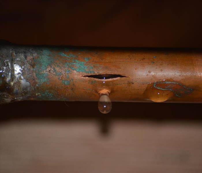 split copper pipe dripping water