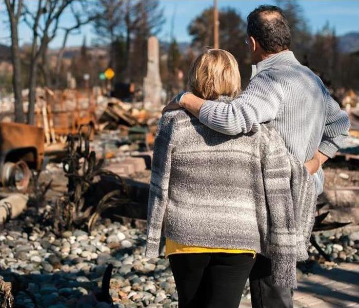 People holding one another After a Fire