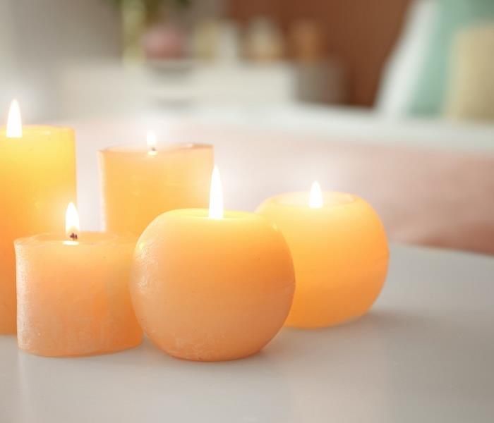 several burning candles on a table