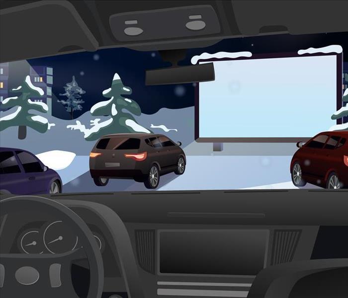 car view of drive-in movie with snow
